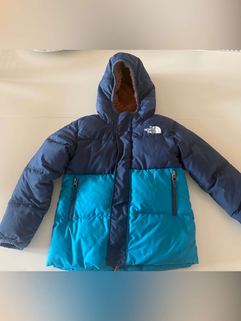 The North Face Kids Two-Tone Navy and Teal Puffer Jacket with Hood